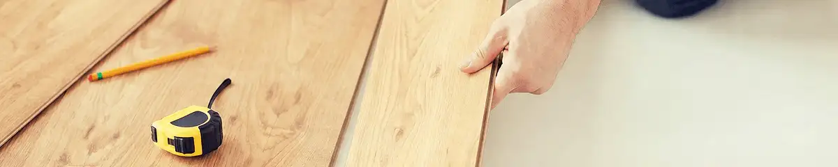 A professional installing wood flooring in Colorado Springs, CO