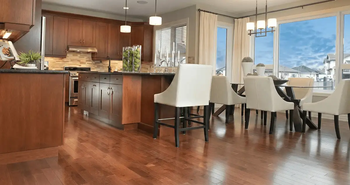 A modern kitchen with professionally installed wood flooring in Colorado Springs, CO