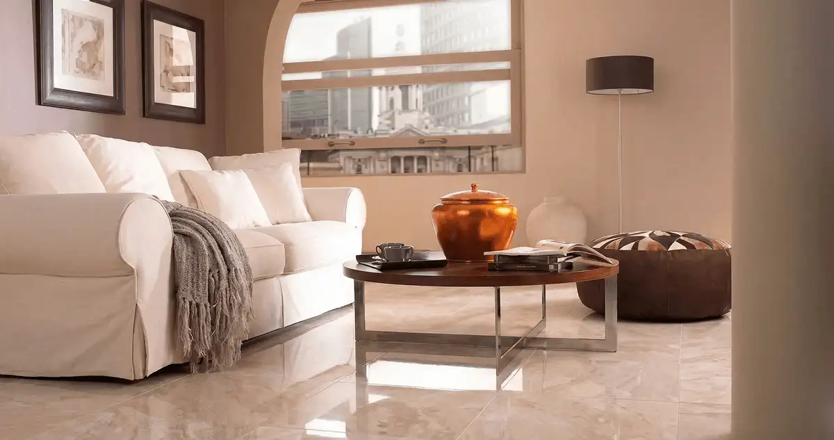Modern living room with professionally installed marble flooring, a beige sofa, coffee table in Colorado Springs, CO