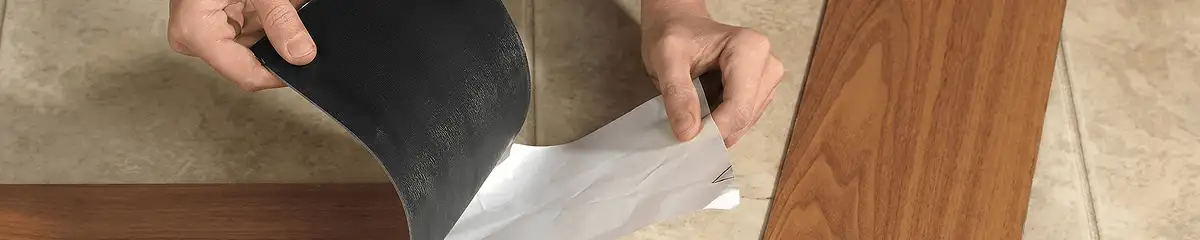 A professional installing vinyl flooring in Colorado Springs, CO
