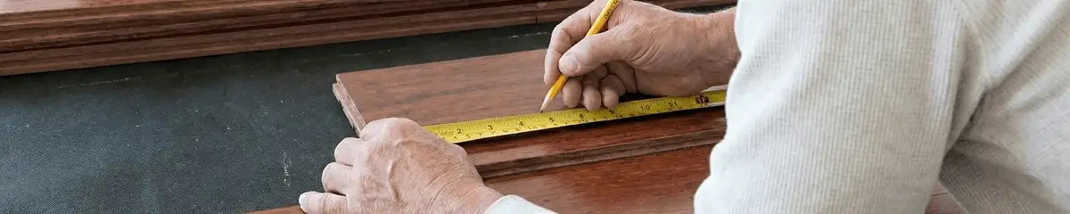 A professional installing wood flooring in Colorado Springs, CO